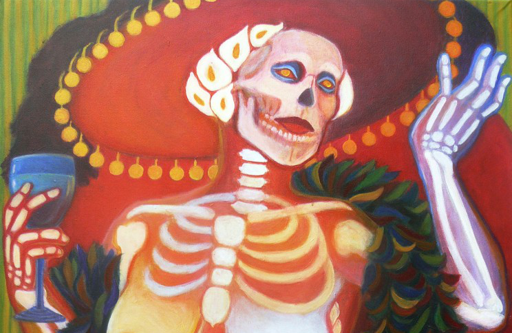 detail of "La Catrina" a skeleton woman in a large hat with flowers for hair.