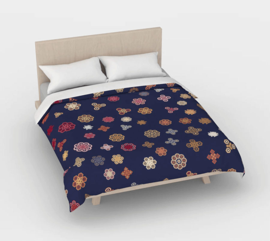 Mathematical snowflake pattern with a navy background on a bed duvet